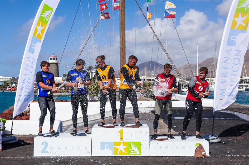 49er podium with champagne celebrations in Marina Rubicón - photo © Jacobo Bastos / Lanzarote Sailing Center