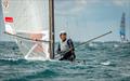 A Class Cat Worlds at Punta Ala - Kuba Surowiec, POL, crosses the line in a masterclass demo of high wind A-Cat foil sailing to win his second and consecutive Open World Championship © Gordon Upton / www.guppypix.com