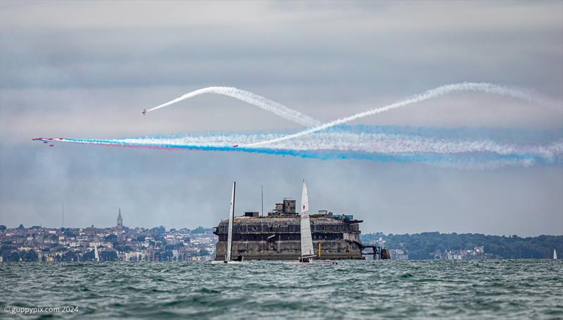 The Red Arrows attempt to distract Hugh Macgregor, on the A-Cat and Andre McQueen on his Unicorn during the Unicorn and A Class Catamaran Nationals at Hayling Ferry SC - photo © Gordon Upton / www.guppypix.com