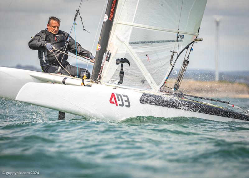 Owen Cox battles upwind on his Exploder Ad3 in the hearty chop of day one of the Unicorn and A Class Catamaran Nationals at Hayling Ferry SC - photo © Gordon Upton / www.guppypix.com