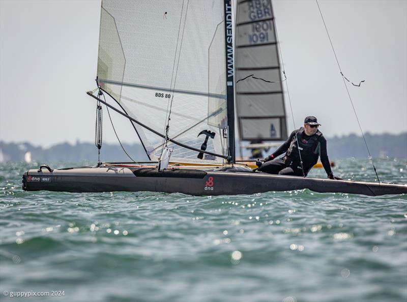 Ben Daignault in full low drag, downwind mode on his DNA F1x during the Unicorn and A Class Catamaran Nationals at Hayling Ferry SC - photo © Gordon Upton / www.guppypix.com