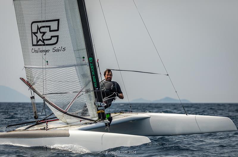 A Class Cat Regata Nazionale - Italian sailor, Francisco Mainaro, ITA 583 was happy to be lying second in the Classic fleet at the end of day 1 photo copyright Gordon Upton / www.guppypix.com taken at Centro Velico Punta Ala and featuring the A Class Catamaran class