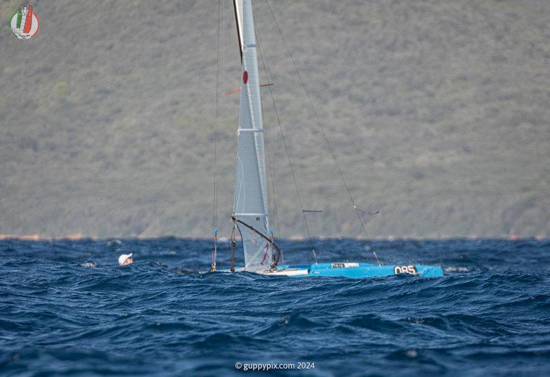 Veteran US sailing Legend Ben Hall USA 99, just hanging in there for a good mid-fleet finish in high end conditions - A Class Cat Worlds at Punta Ala day 1 photo copyright Gordon Upton / www.guppypix.com taken at Centro Velico Punta Ala and featuring the A Class Catamaran class