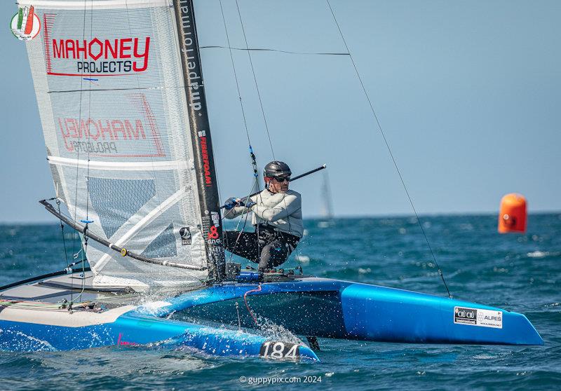 US Champ Bruce Mahoney is having a good regatta - A Class Cat Worlds at Punta Ala day 2 photo copyright Gordon Upton / www.guppypix.com taken at Centro Velico Punta Ala and featuring the A Class Catamaran class