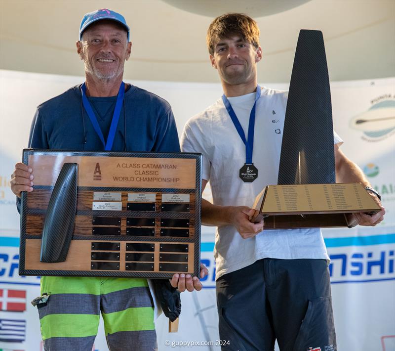 A Class Cat Worlds at Punta Ala - The 2024 World Champions. Gustavo Doreste Blanco, ESP 72, Classic Champ, and Kuba Surowiec, POL 41, Open Champ photo copyright Gordon Upton / www.guppypix.com taken at Centro Velico Punta Ala and featuring the A Class Catamaran class