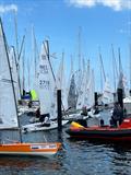 An on-water traffic jam on Saturday during Kieler Woche when five fleets are released to launch at once © Martin Pascoe