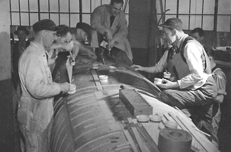 The first stage of manufacture as layers of lightweight beech ply are glued before being laid up over the mould photo copyright Fairey Aviation taken at  and featuring the Classic & Vintage Dinghy class