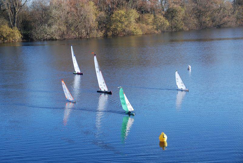 The small boats leading Rob Vice's Marblehead over the line - Marblehead Brass Monkey and GAMES 13 event at Abbey Meads, Chertsey - photo © Slieve Mcgalliard