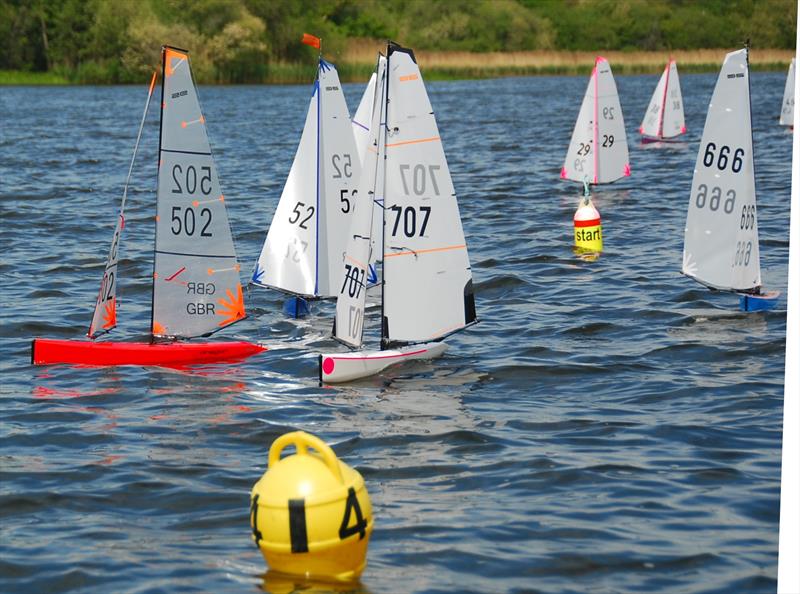Close racing approaching the gate during the DF95 M&S Travellers Event 2 for the ASH Trophy at Guildford Model Yacht Club photo copyright Roger Stollery taken at Guildford Model Yacht Club and featuring the DF95 class