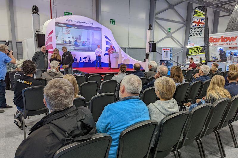 Jon Emmett and Simon Lovesey present the Seldén SailJuice Winter Series prizes at the RYA Dinghy & Watersports Show 2022 photo copyright Mark Jardine / YachtsandYachting.com taken at RYA Dinghy Show and featuring the Dinghy class
