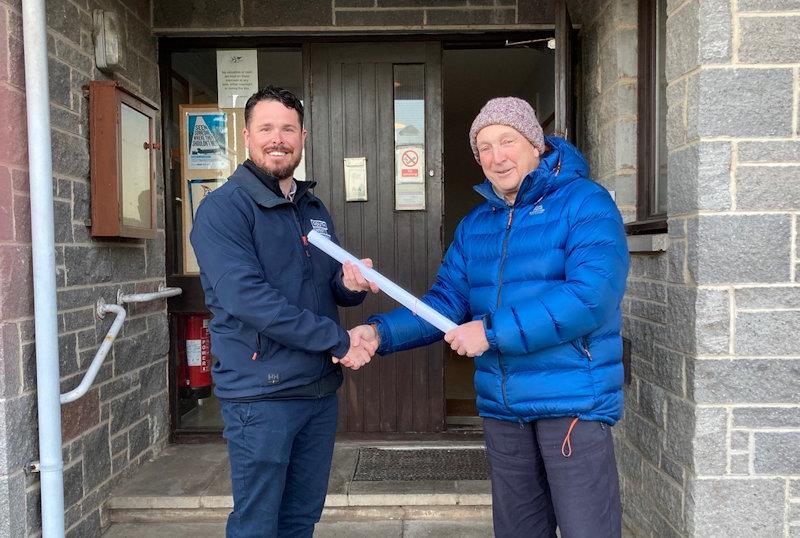 Solway YC member, Ian Purkis (right) hands the Building Standards (Scotland) approved plans for the project to Paul Widdowson, Director of South West Trades photo copyright Robert Dinwiddie taken at Solway Yacht Club and featuring the Disabled class