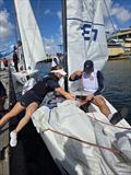Evie Haseldine with Royal Australian Air Force sailor © Australian Sailing
