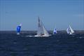 Magpie leads the fleet around the leeward mark in race three, favouring the port pin of the gate on day 1 of the Etchells Australian Championship © Jeanette Severs