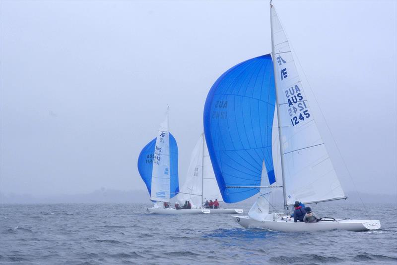 Quandong, Leading Edge and Odyssey with spinnakers up after rounding the windward mark, in race one of the 2025 East Gippsland Etchells Championship photo copyright Jeanette Severs taken at Metung Yacht Club and featuring the Etchells class