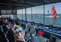 Emirates Great Britain SailGP Team helmed by Ben Ainslie sail past the Team Coach Boxes and Race Management Platform on Race Day 1 of the Emirates Sail Grand Prix  © Adam Warner for SailGP