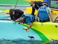 SailGP tech team repair a hole in the hull of the Mubadala Brazil SailGP Team F50 catamaran on the water, ahead of racing on Race Day 2 of the Rolex Switzerland Sail Grand Prix held in Geneva © Ricardo Pinto for SailGP