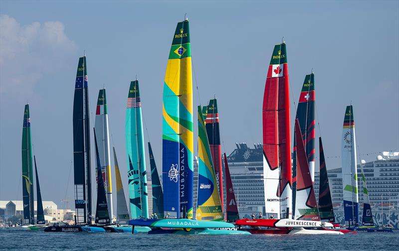 The SailGP fleet in action with Mubadala Brazil SailGP Team and Canada NorthStar SailGP Team in the foreground during racing on Race Day 1 of the Emirates Dubai Sail Grand Prix - November 23, 2024 - photo © Simon Bruty/SailGP