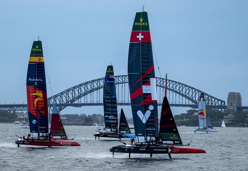 Switzerland SailGP Team helmed by Sebastien Schneiter with New Zealand SailGP Team, Spain SailGP Team and Red Bull Italy SailGP Team during racing in front of Sydney Harbour Bridge on Race Day 1 of the KPMG Australia Sail Grand Prix - photo © Jason Ludlow for SailGP