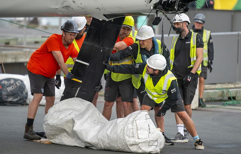 Members of the SailGP shore team works on the wreckage of the DS Automobiles SailGP Team France F50 catamaran on Race Day 1 of the ITM New Zealand Sail Grand Prix in Auckland, New Zealand - photo © James Gourley for SailGP