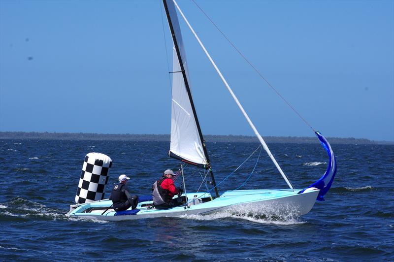 Gary Cameron and Darren Hocking take Blu Tak AUS338 with a failed spinnaker surf across the finish line into a respectable fifth place in race four of the Flying Dutchman 2026 Australian Championship - photo © Jeanette Severs