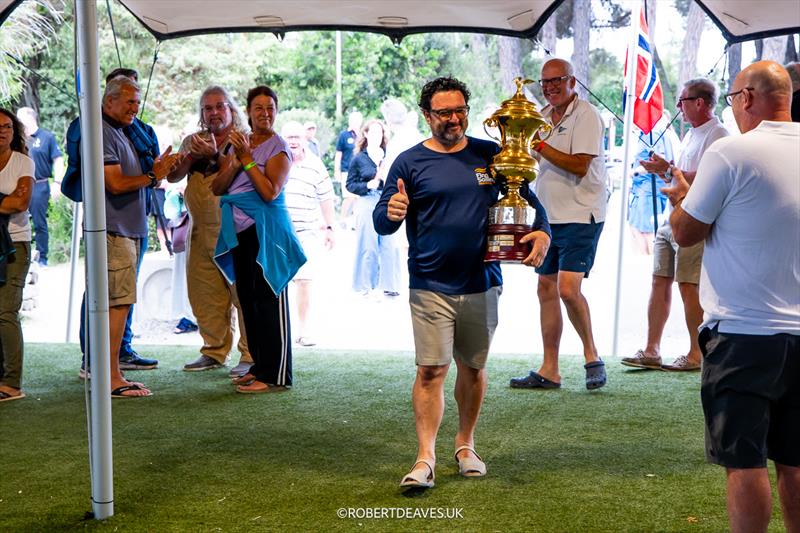 Filipe Silva returns the Masters Gold Cup during the 2024 Finn World Masters Opening Ceremony photo copyright Robert Deaves / www.robertdeaves.uk taken at Centro Velico Punta Ala and featuring the Finn class