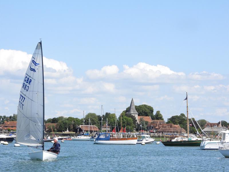 Howard Sellars (Warsash SC) leaves the slipway with the picturesque village of Bosham in the background during the Bosham Finn Open 2024 - photo © Greg Grant