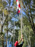 Raising the flag to signal the end of the day's racing on day 4 of the Fireball Europeans at Maccagno © Frank Miller