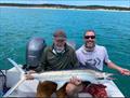 Joup and his Dad with a juvenile black marlin caught with Hervey Bay Fly & Sportfishing