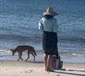 The boss lady, Maina, enjoying a well-earned break over on Fraser Island's western shore. The dingo's company is just a bonus of the island life