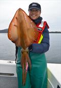 Devi Barker with a big 40cm+ hood calamari fishing on the Tasman Peninsula. Caught on a BMT Squid Snatcher 3.5