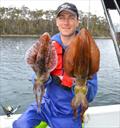 Kirill with a couple nice sized calamari fishing on the Tasman Peninsula