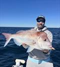 Voltage coloured Daiwa Baitjunkie Jerkshads were a hit with the big snapper off the Wide Bay bar yesterday. Kealan with a beauty