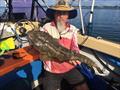 Tony with a sample of the big flathead lurking in the lower reaches of the Burrum