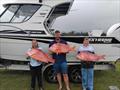 The Parker family with a brace of fine reds from their latest offshore mission