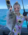Ella Whittle enjoyed showing her brothers how to catch trevally on a jig
