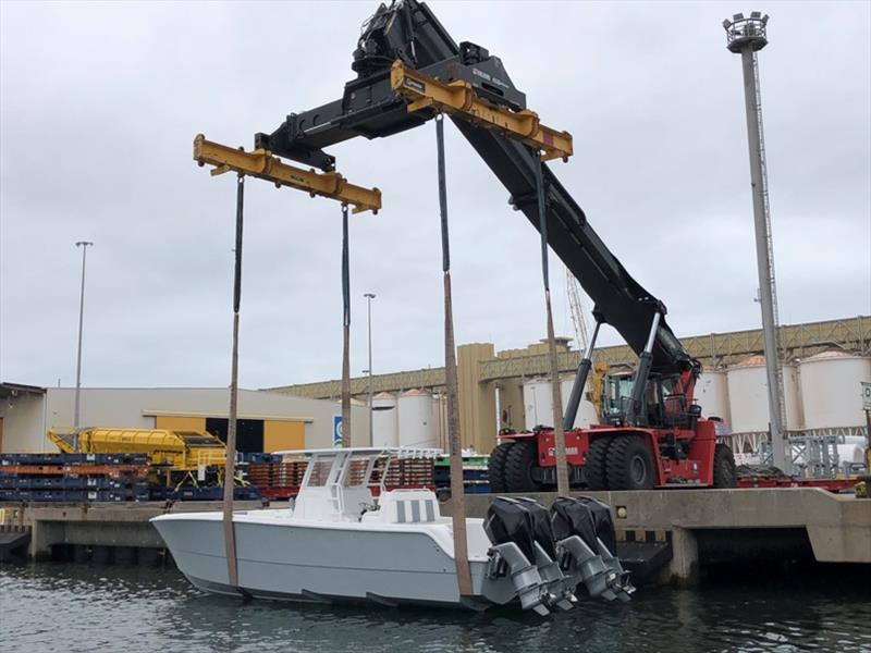 Invincible 35' Catamaran gets lifted from the RoRo into Australian waters - stern photo copyright Boat Monster taken at  and featuring the Fishing boat class