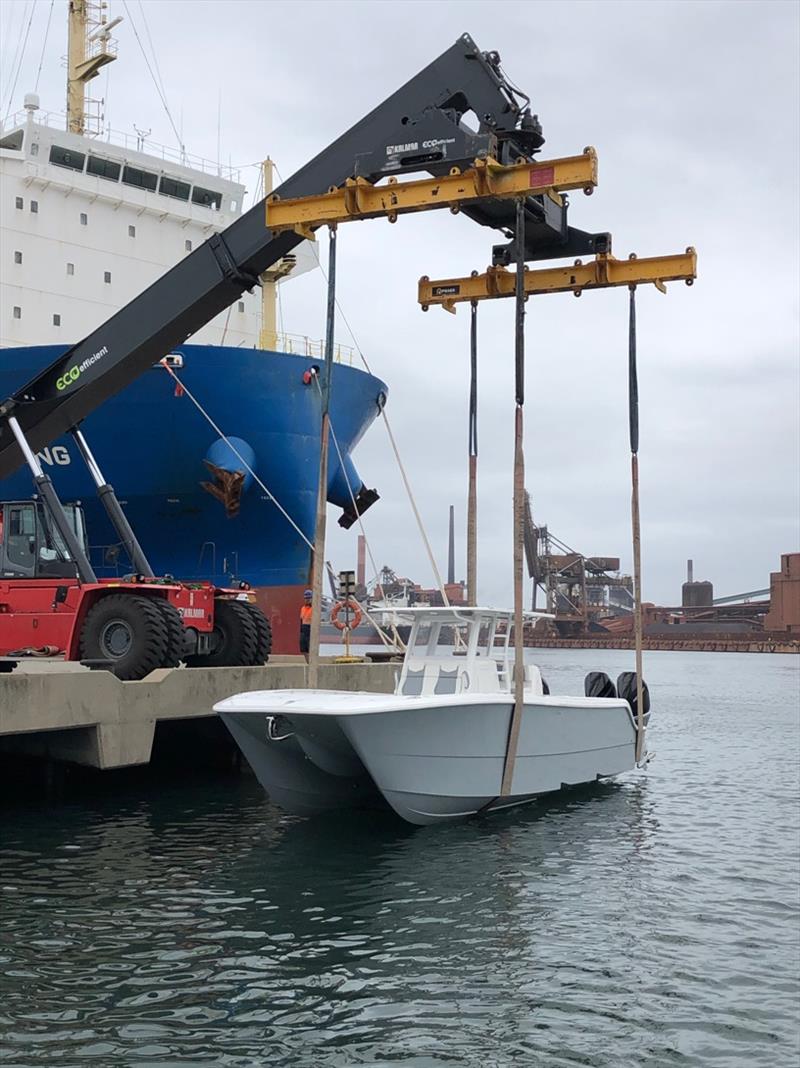 Invincible 35' Catamaran gets lifted from the RoRo into Australian waters - bow photo copyright Boat Monster taken at  and featuring the Fishing boat class