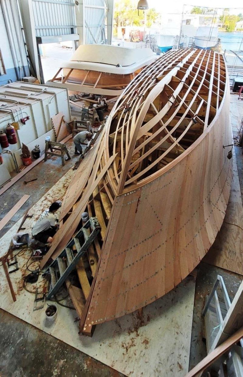 Hull #8 First layer of hull planking - photo © Michael Rybovich & Sons