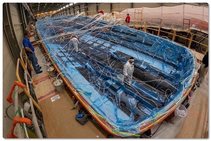 Resin continues to be drawn outboard and up the hull sides - photo © Viking Yachts
