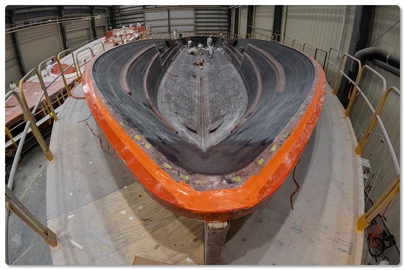 After the resin is cured, the vacuum bag, vacuum lines, feed lines and other materials are removed - photo © Viking Yachts