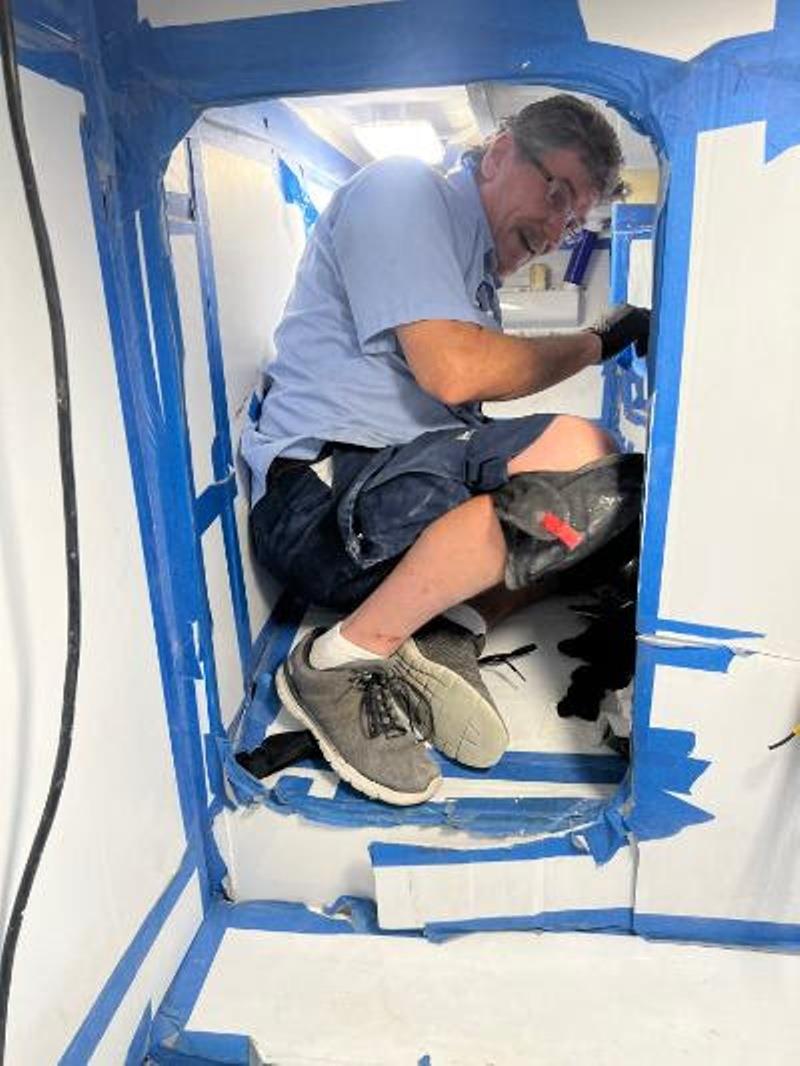 Brian installing Hull #7 steering - photo © Michael Rybovich & Sons