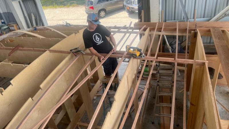 Ricky installing Hull #8 deckhouse beams - photo © Michael Rybovich & Sons