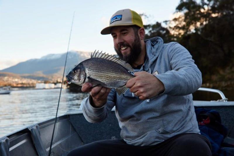 Success! A tough grind in cold conditions but perseverance paid off. Phil landing this nice bream.  photo copyright Spot On Fishing Hobart taken at  and featuring the Fishing boat class