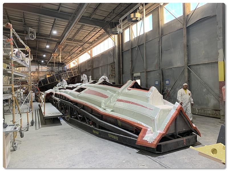 In Viglass, dry materials are loaded into the mold for the structural stringer grid for a V-55 prior to its infusion process - photo © Viking Yachts