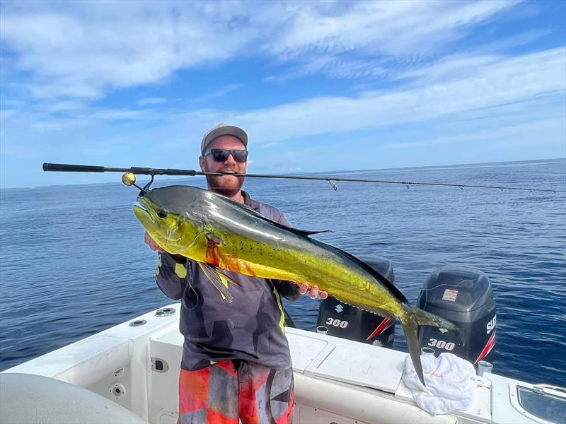 Andrew with a lit up mahi mahi, aka dolphin fish - photo © Fisho's Tackle World