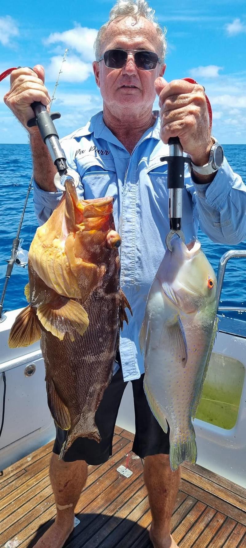 Wayne with a double header of brown maori cod and tuskfish - photo © Fisho's Tackle World