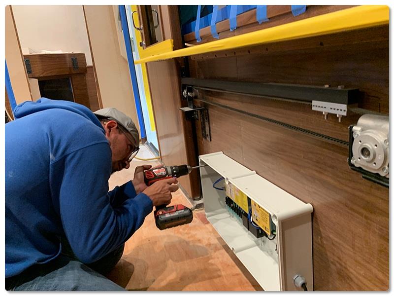Finish Electrician Carlos Hernandez installs the automatic control box photo copyright Viking Yachts taken at  and featuring the Fishing boat class