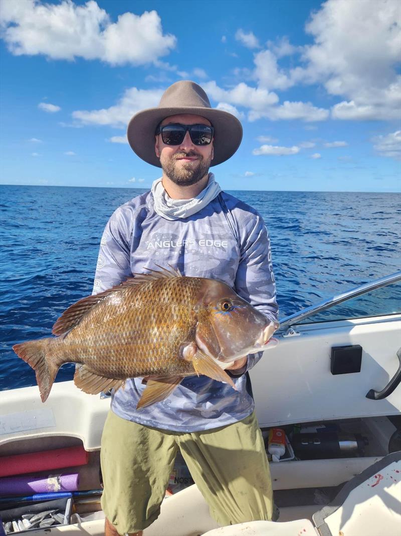 Aedan Arnold with a very solid offshore grassy sweetlip, often caught whilst fishing away from the main structures on the broken bottom flat country - photo © Fisho's Tackle World