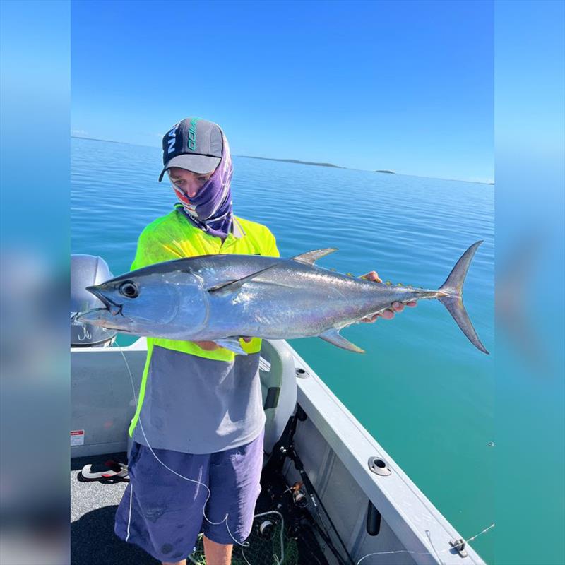 Birchy with a school sized longtail tuna he caught whilst working the birds inshore - photo © Fisho's Tackle World