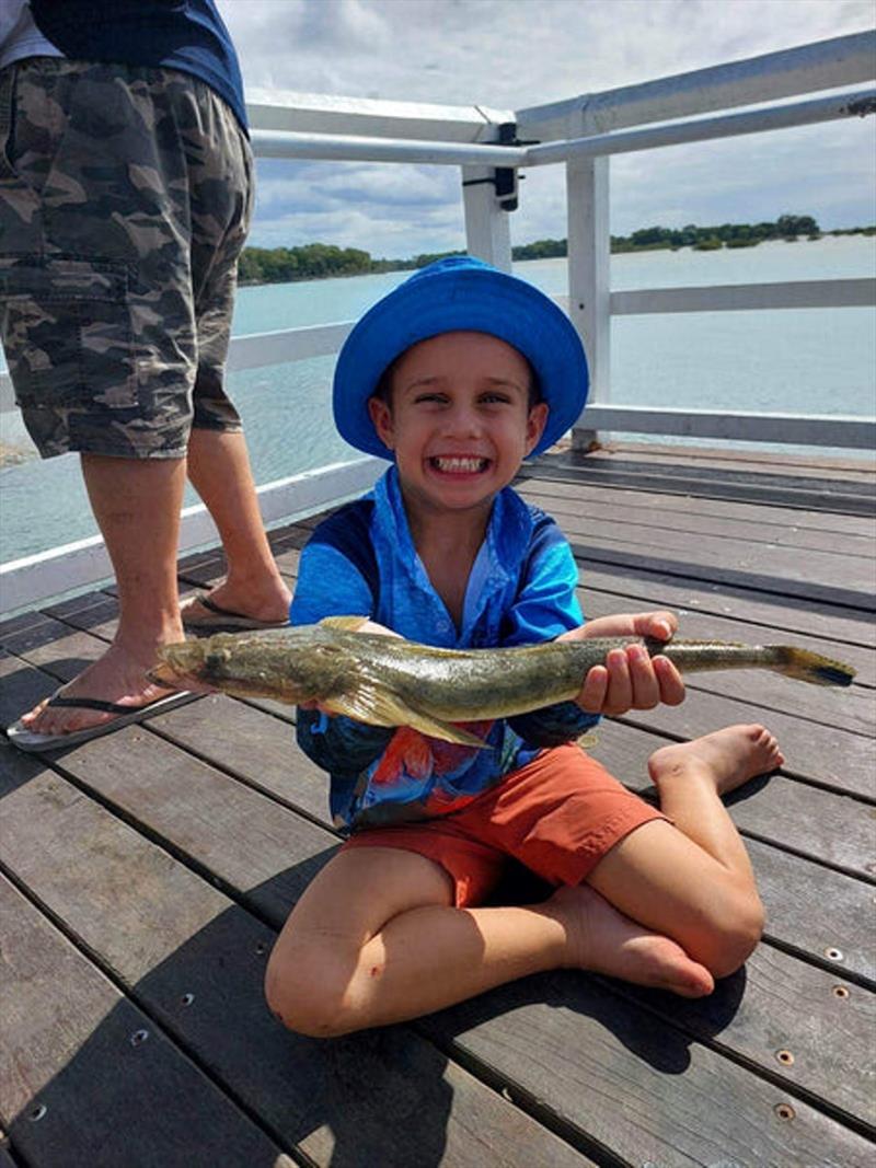 The young gun, Kingy with a nice lizard he caught on a soft plastic all by himself photo copyright Fisho's Tackle World taken at  and featuring the Fishing boat class
